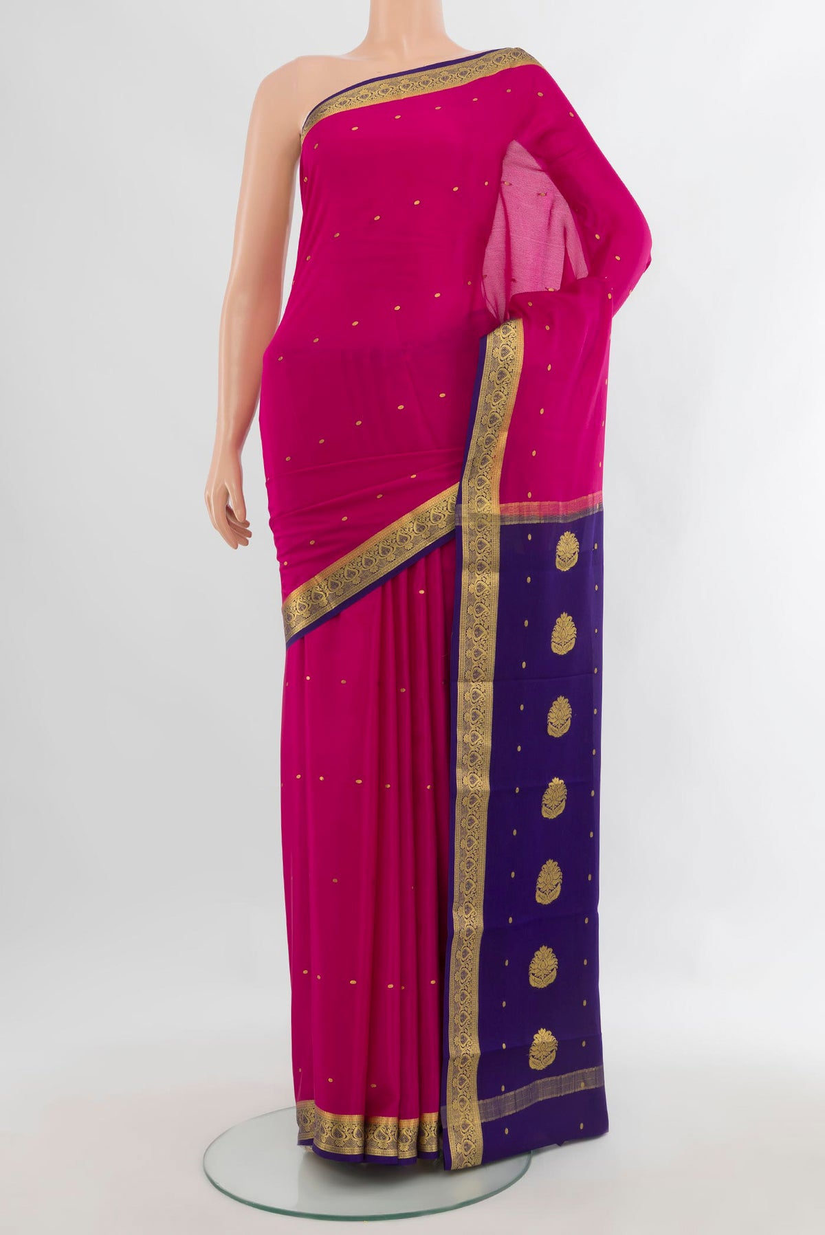 Rani Pink Mysore Crepe Saree with Zari Butta on the body and Zari Border.  displayed on a mannequin