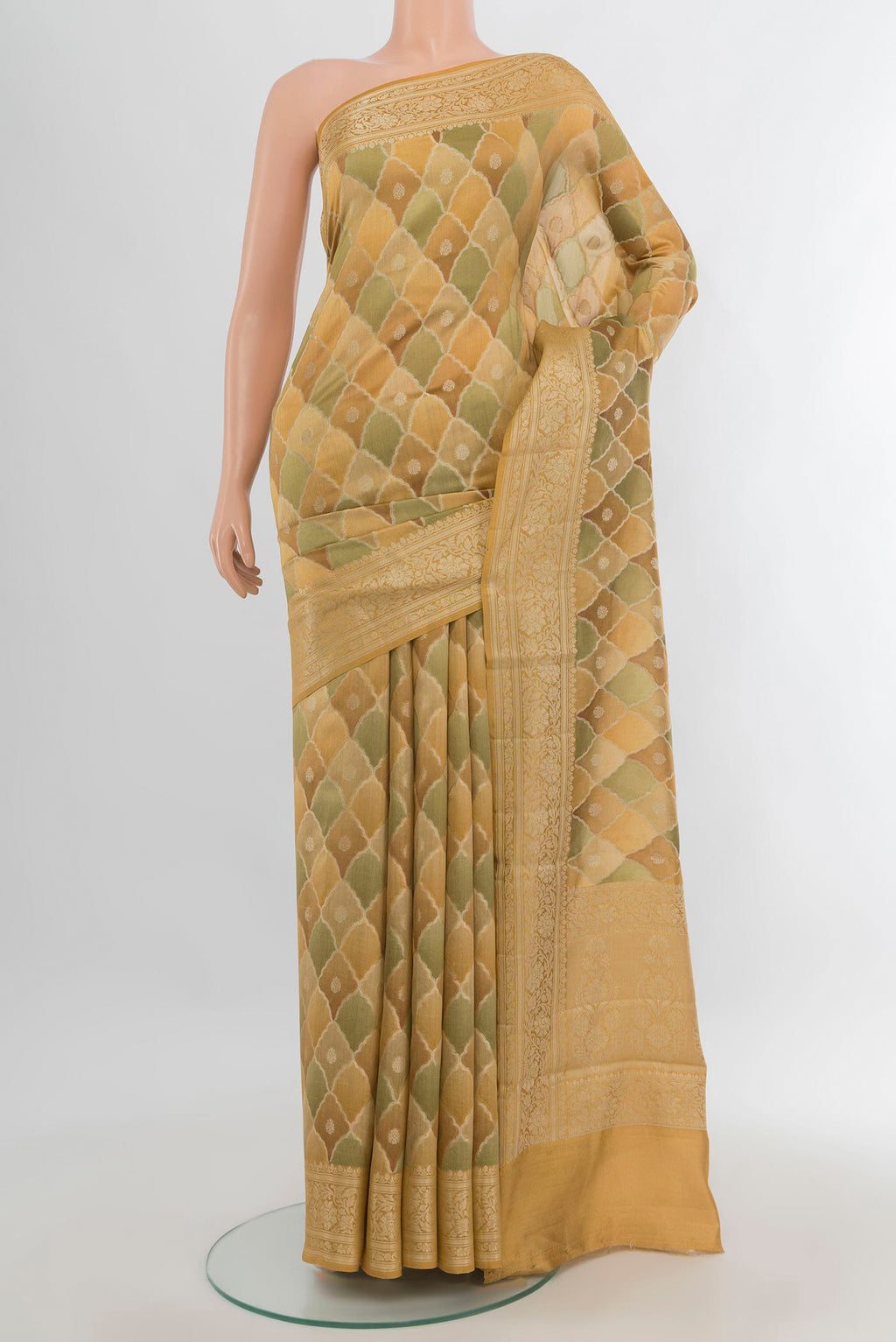 Pure Silk Sandal Banarasi Tussar Saree with Zari Butta on the body and Zari Border.  displayed on a mannequin
