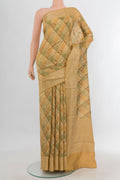 Pure Silk Sandal Banarasi Tussar Saree with Zari Butta on the body and Zari Border.  displayed on a mannequin