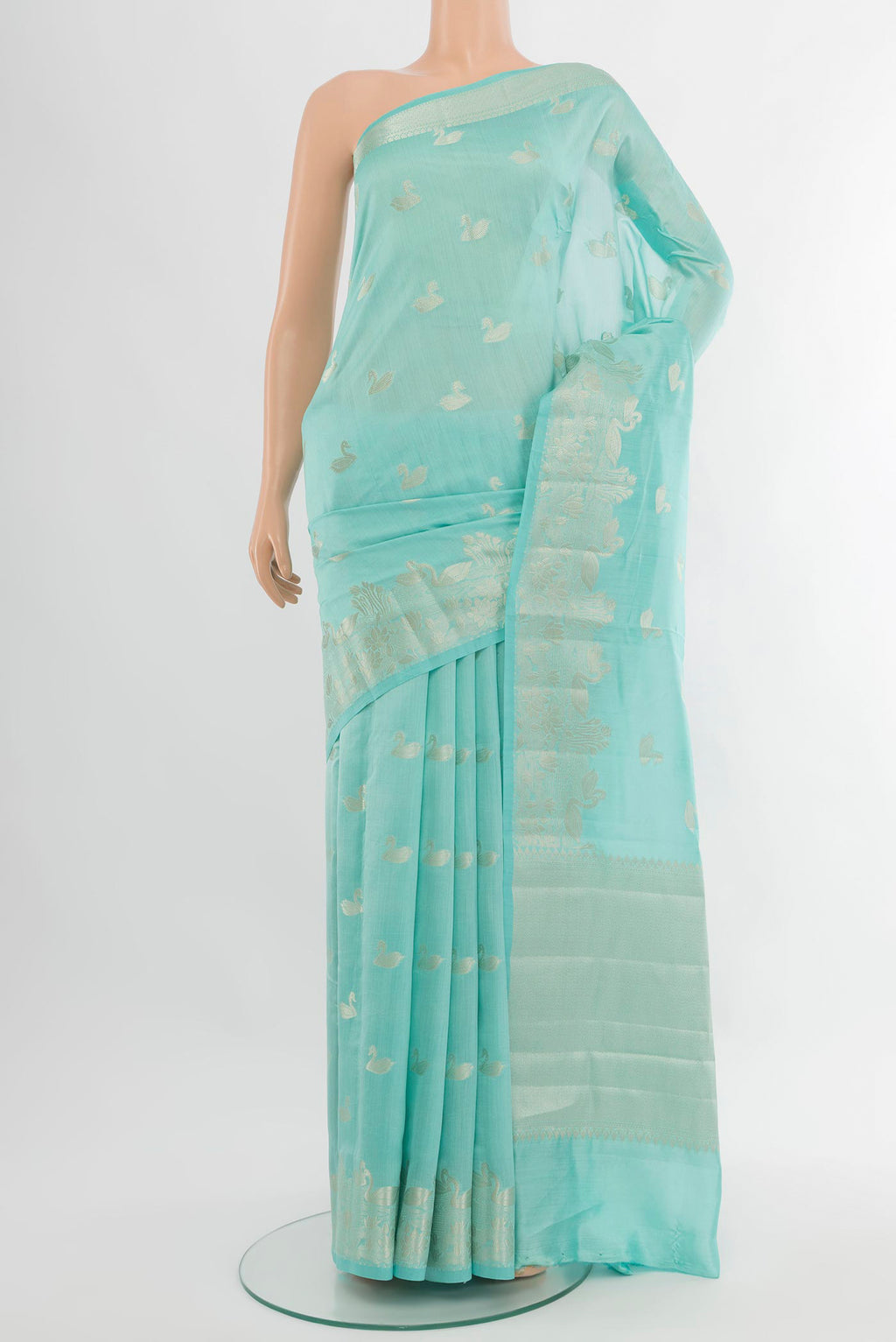 Sky Blue Banarasi Raw Silk Saree with Zari Butta on the body and Zari Border.  displayed on a mannequin