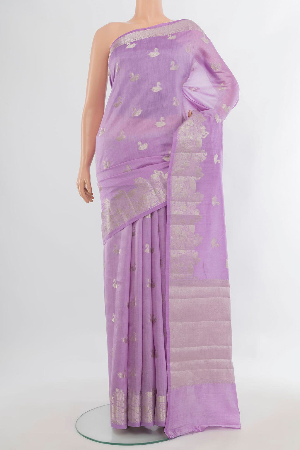 Pure Silk Lavender Banarasi Raw Saree with Zari Butta on the body and Zari Border.  displayed on a mannequin