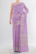 Pure Silk Lavender Banarasi Raw Saree with Zari Butta on the body and Zari Border.  displayed on a mannequin
