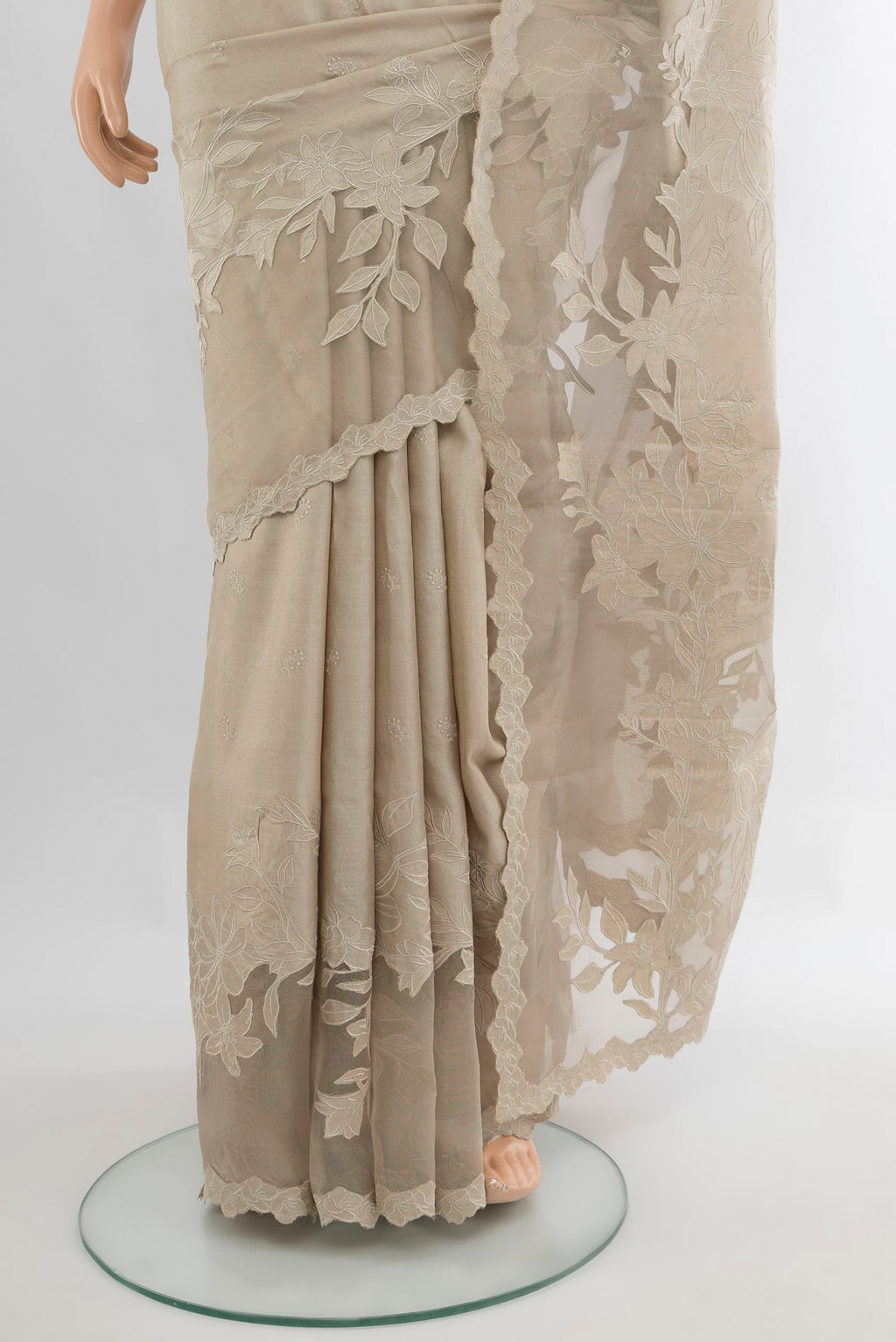 Pleats and pallu of Beige Tussar Saree with Embroidery on the body and Embroidery Border. 