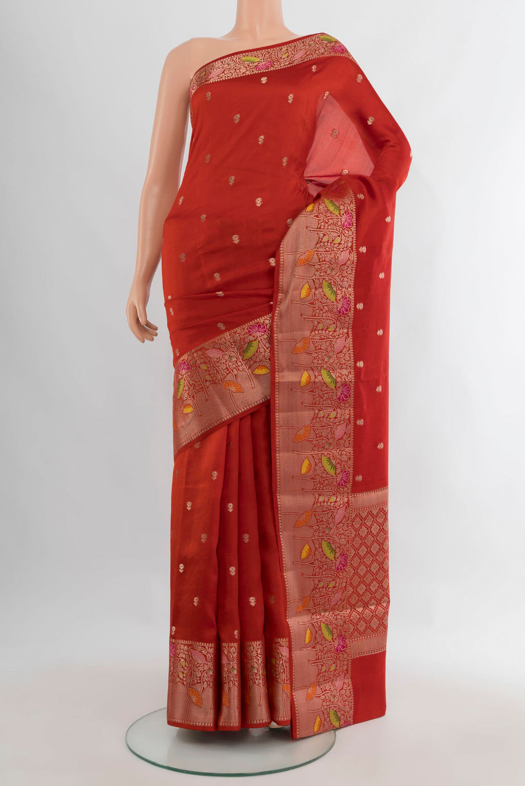 Pure Silk Brick Orange Banarasi Katan Saree with Zari Butta on the body and Zari Border.  displayed on a mannequin