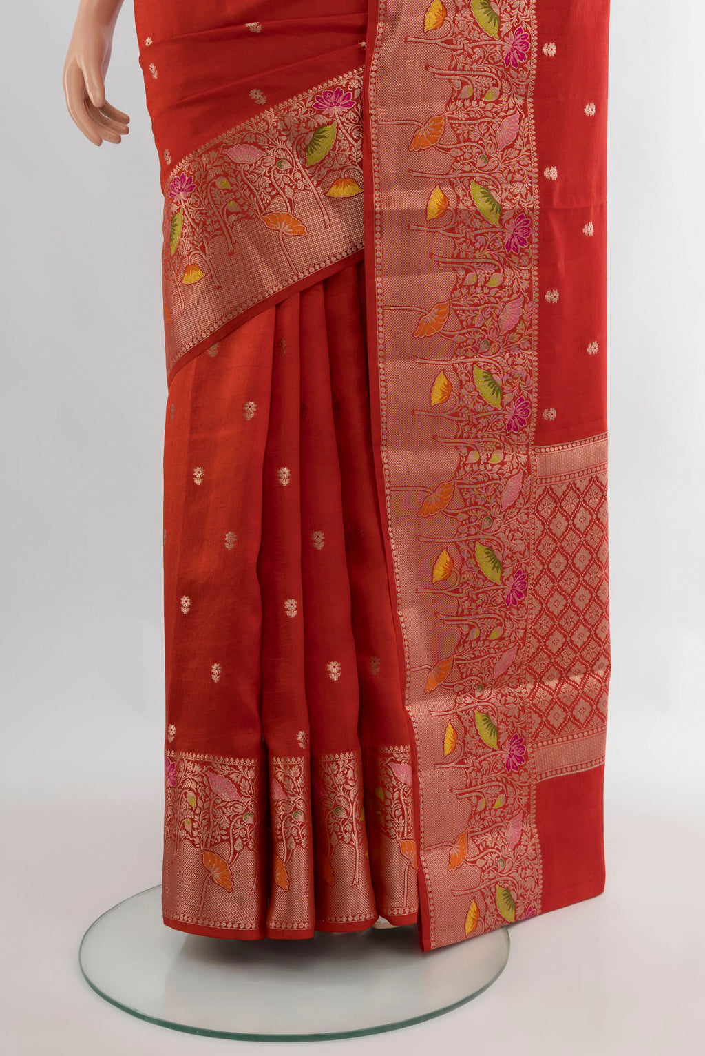 Pleats and pallu of Pure Silk Brick Orange Banarasi Katan Saree with Zari Butta on the body and Zari Border. 