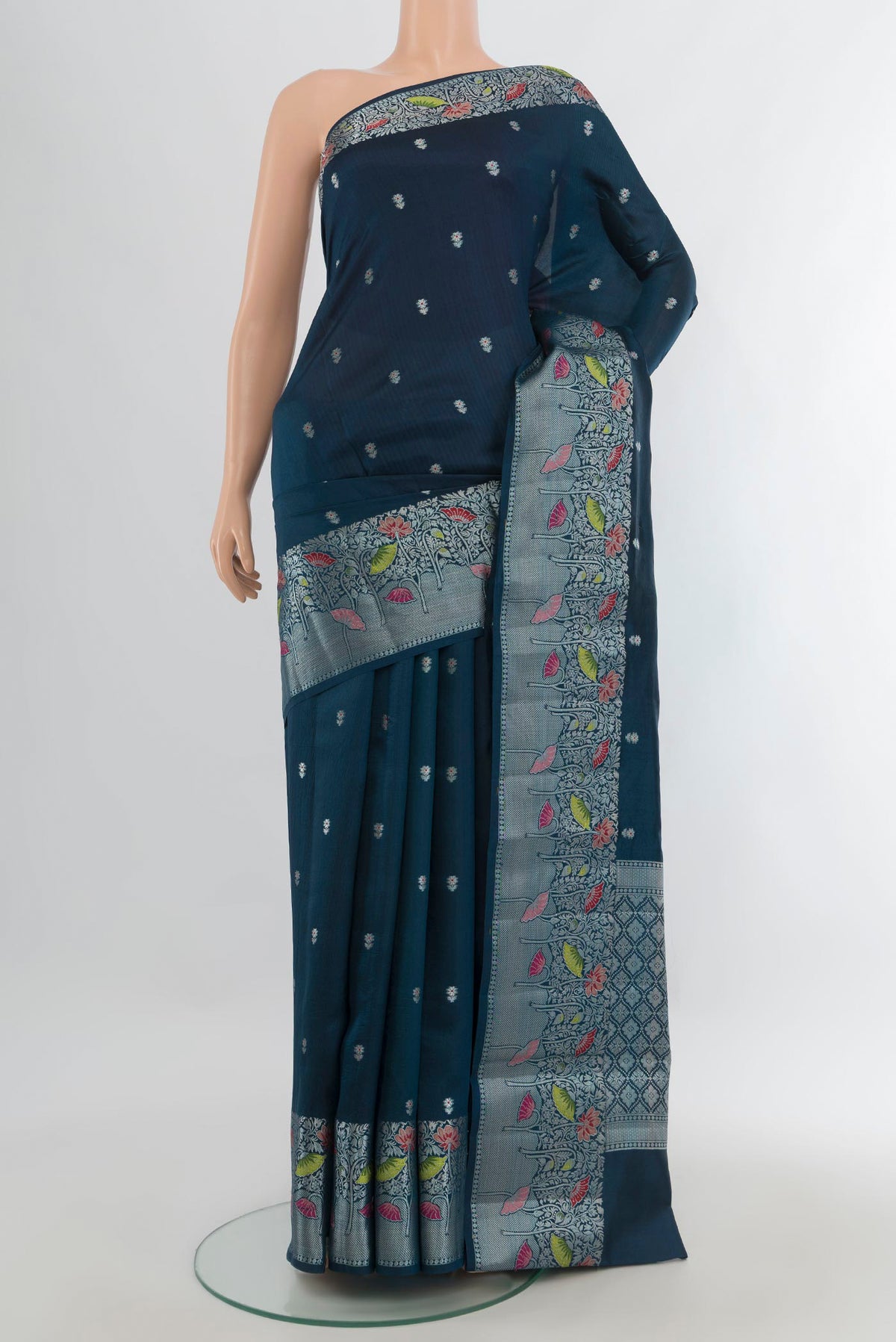 Pure Silk Teal Banarasi Raw Saree with Zari Butta on the body and Zari Border.  displayed on a mannequin