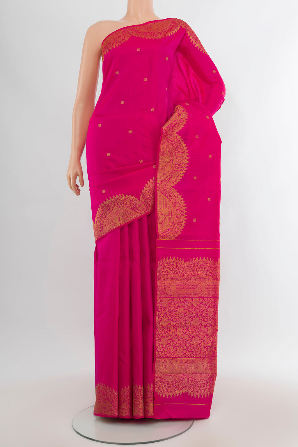 Rani Pink Kanjivaram Silk Saree with Zari Butta on the body and Fancy Border.  displayed on a mannequin
