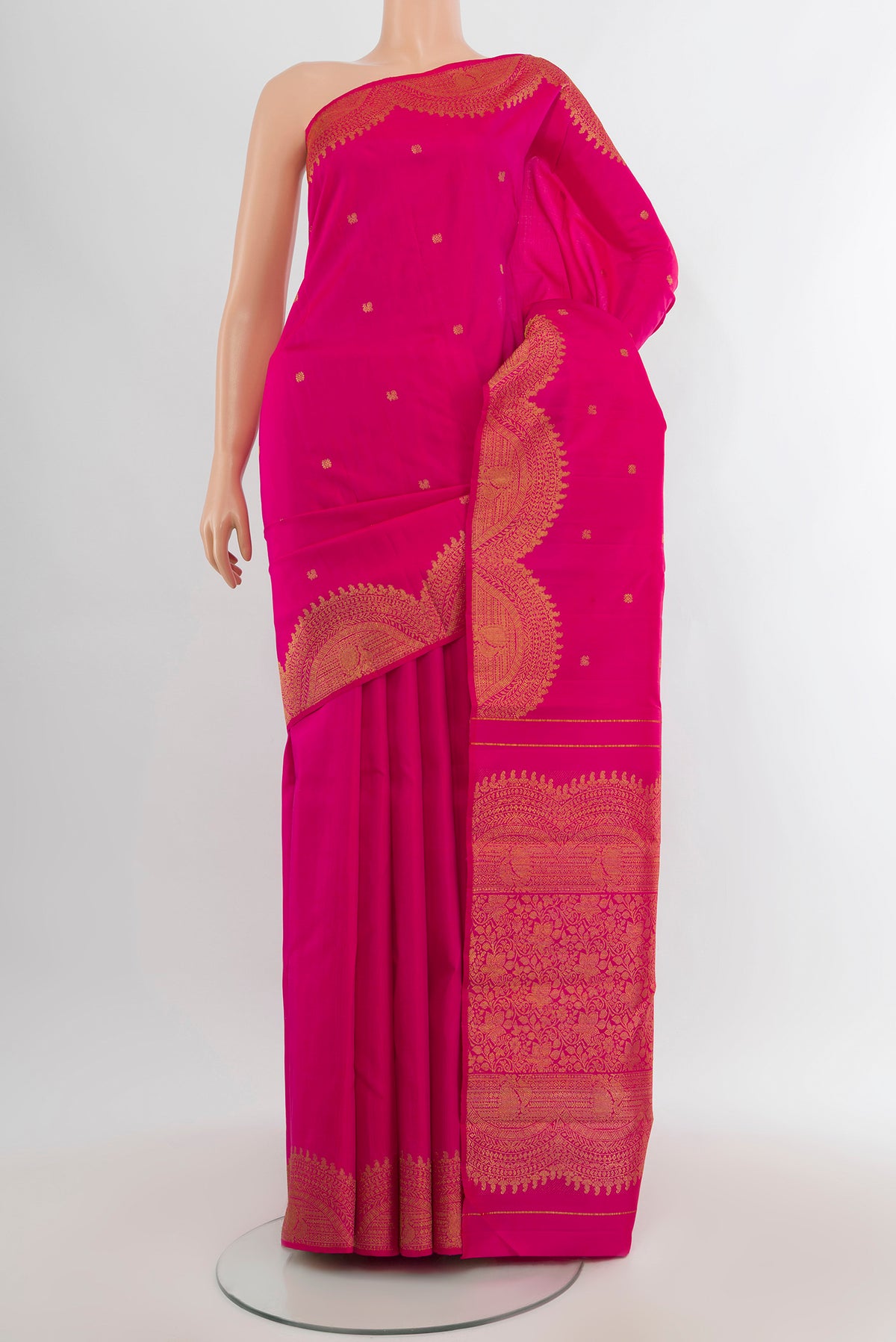 Rani Pink Kanjivaram Silk Saree with Zari Butta on the body and Fancy Border.  displayed on a mannequin