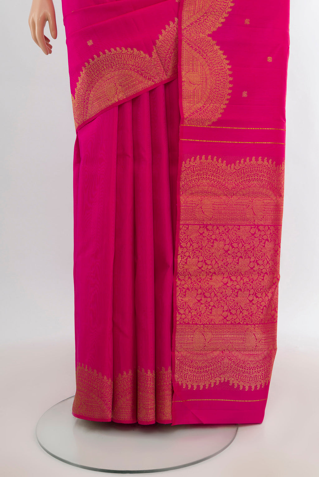Pleats and pallu of Rani Pink Kanjivaram Silk Saree with Zari Butta on the body and Fancy Border. 