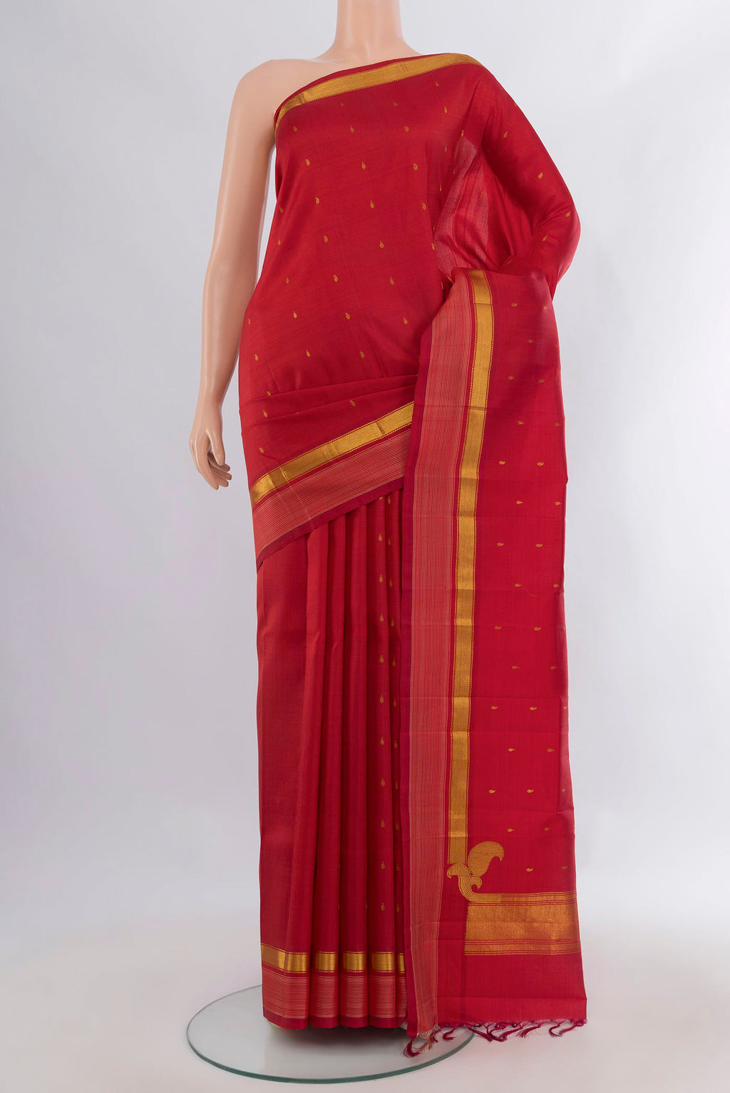 Pure Silk Deep Red Kanchipuram Saree with Zari Butta on the body and Zari Border.  displayed on a mannequin