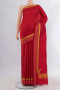 Pure Silk Deep Red Kanchipuram Saree with Zari Butta on the body and Zari Border.  displayed on a mannequin