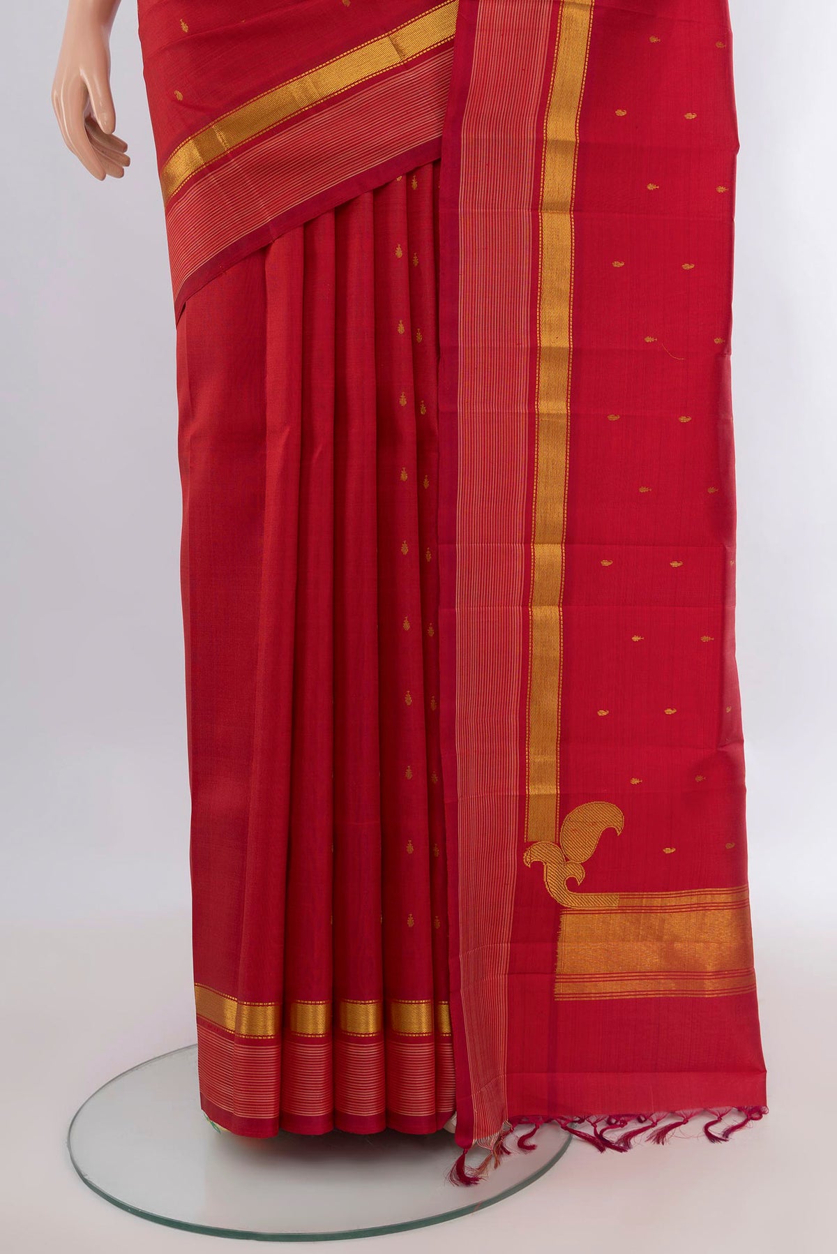 Pleats and pallu of Pure Silk Deep Red Kanchipuram Saree with Zari Butta on the body and Zari Border. 