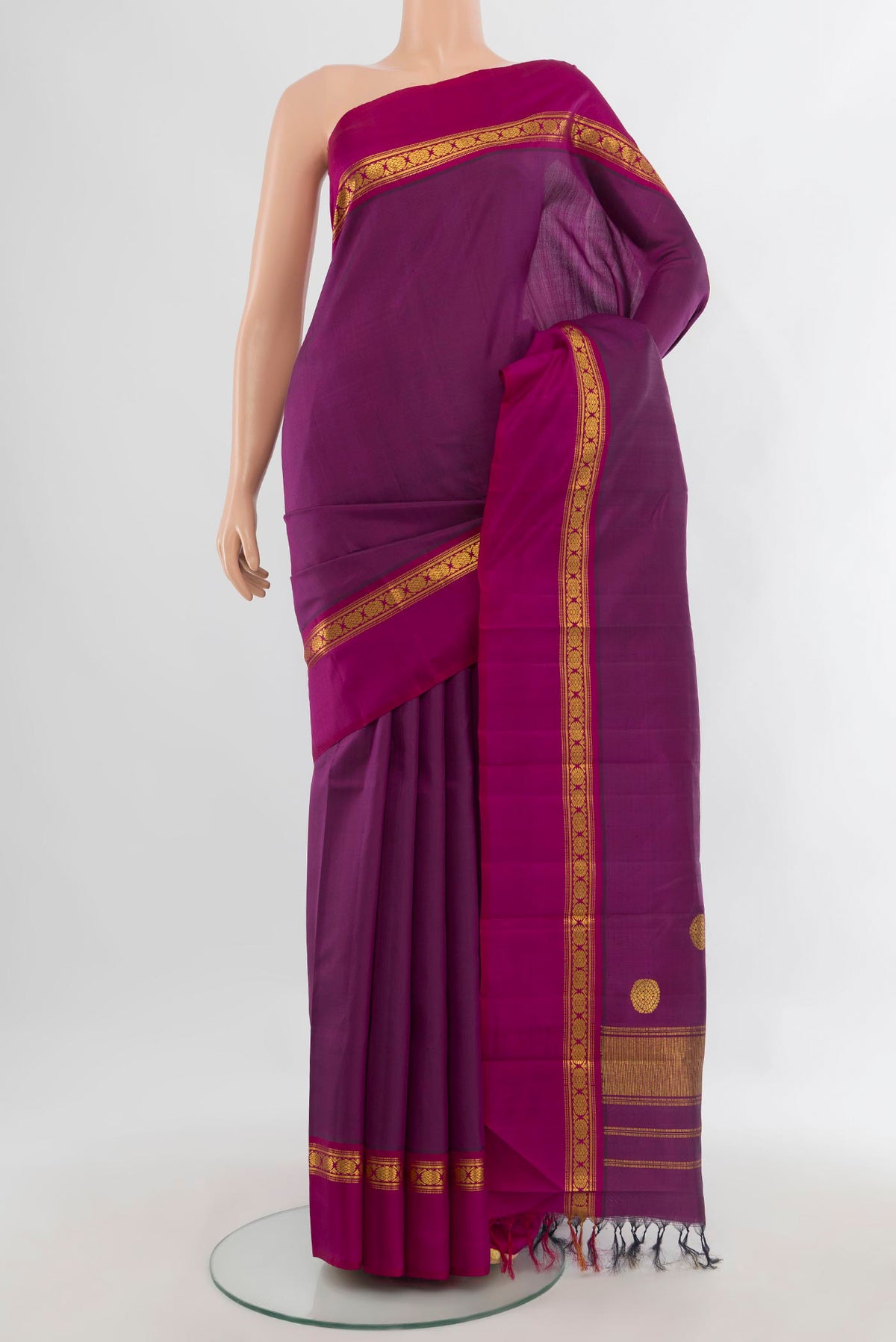Pure Silk Purple Kanchipuram Saree with Plain Body and Zari Border.  displayed on a mannequin
