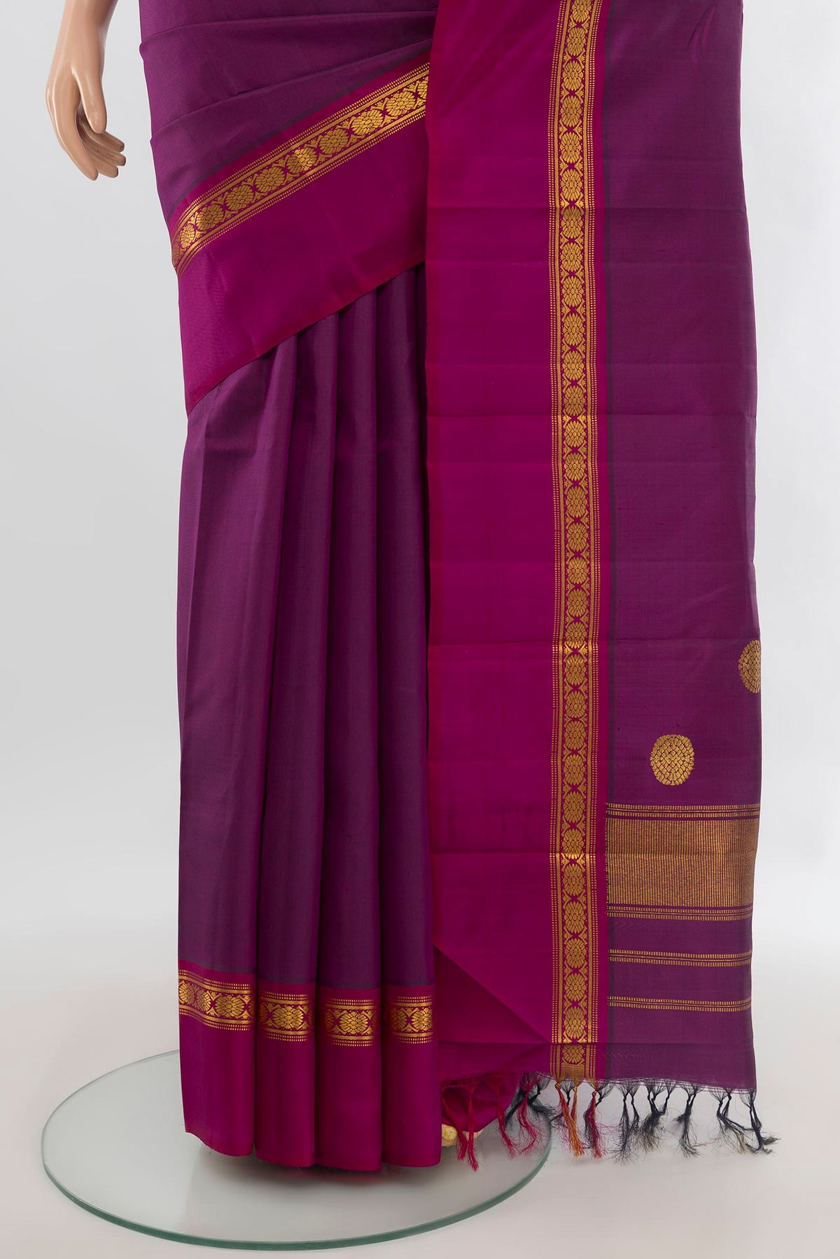 Pleats and pallu of Pure Silk Purple Kanchipuram Saree with Plain Body and Zari Border. 
