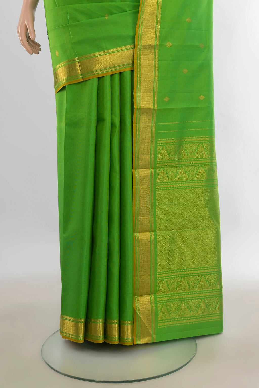 Pleats and pallu of Pure Silk Parrot Green Kanjivaram Saree with Zari Butta on the body and Zari Border. 