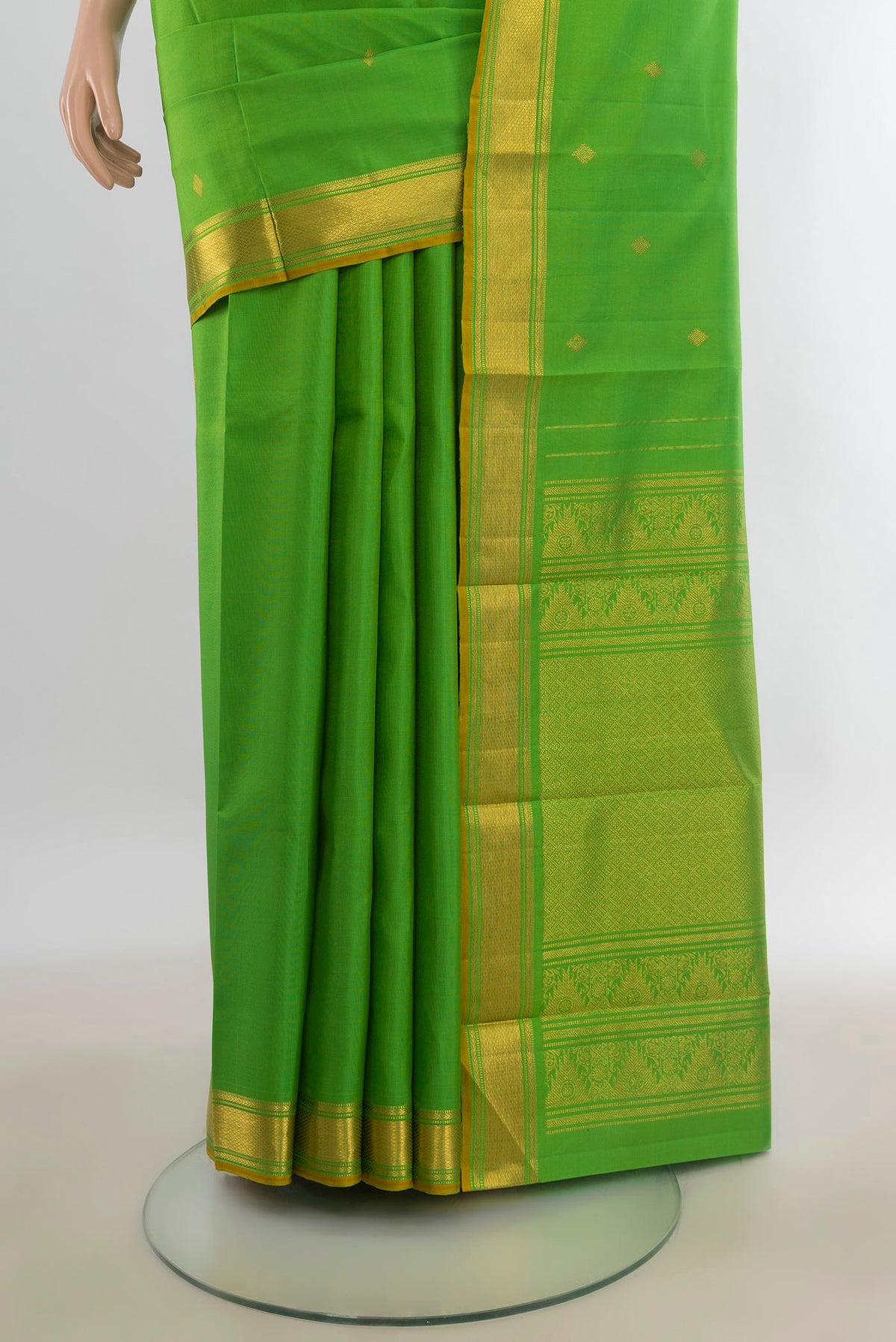 Pleats and pallu of Pure Silk Parrot Green Kanjivaram Saree with Zari Butta on the body and Zari Border. 