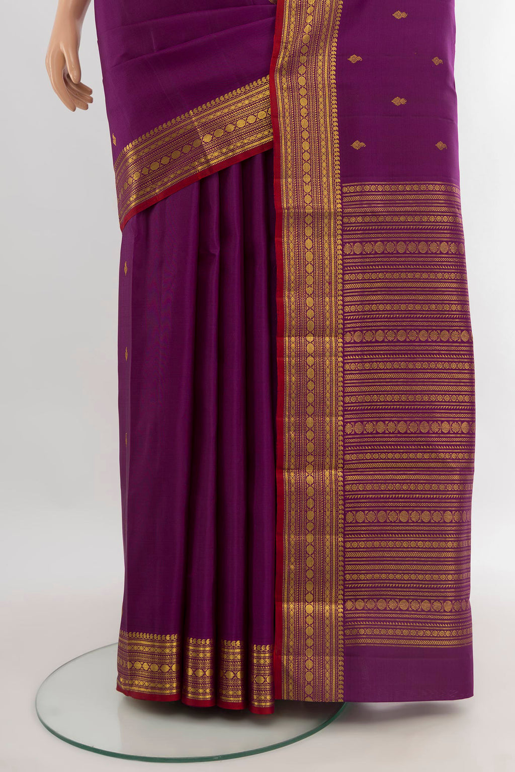 Pleats and pallu of Purple Kanjivaram Silk Saree with Zari Butta on the body and Zari Border. 