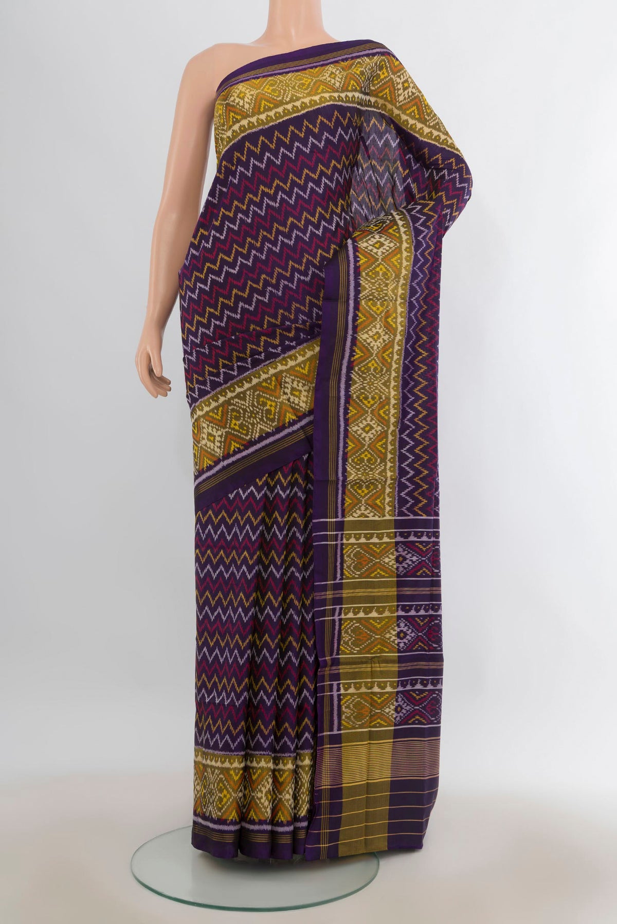 Pure Silk Violet Rajkot Patola Saree with Pure Ikat on the body and Ikat Border.  displayed on a mannequin