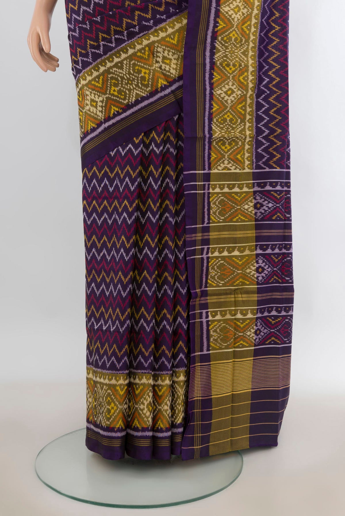 Pleats and pallu of Pure Silk Violet Rajkot Patola Saree with Pure Ikat on the body and Ikat Border. 