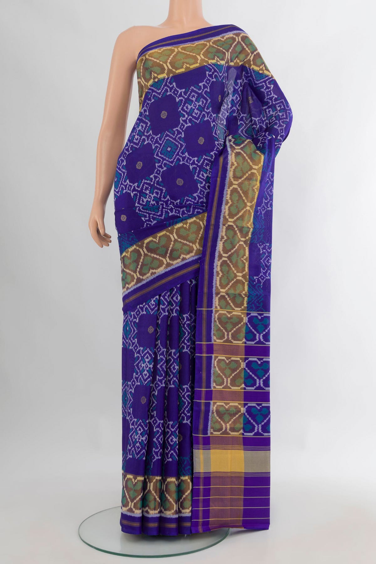 Pure Silk Royal Blue Rajkot Patola Saree with Pure Ikat on the body and Ikat Border.  displayed on a mannequin