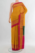 Pure Silk Yellow Rajkot Patola Saree with Pure Ikat on the body and Ikat Border.  displayed on a mannequin