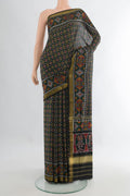 Pure Silk Multi Color Rajkot Patola Saree with Pure Ikat on the body and Zari Border.  displayed on a mannequin