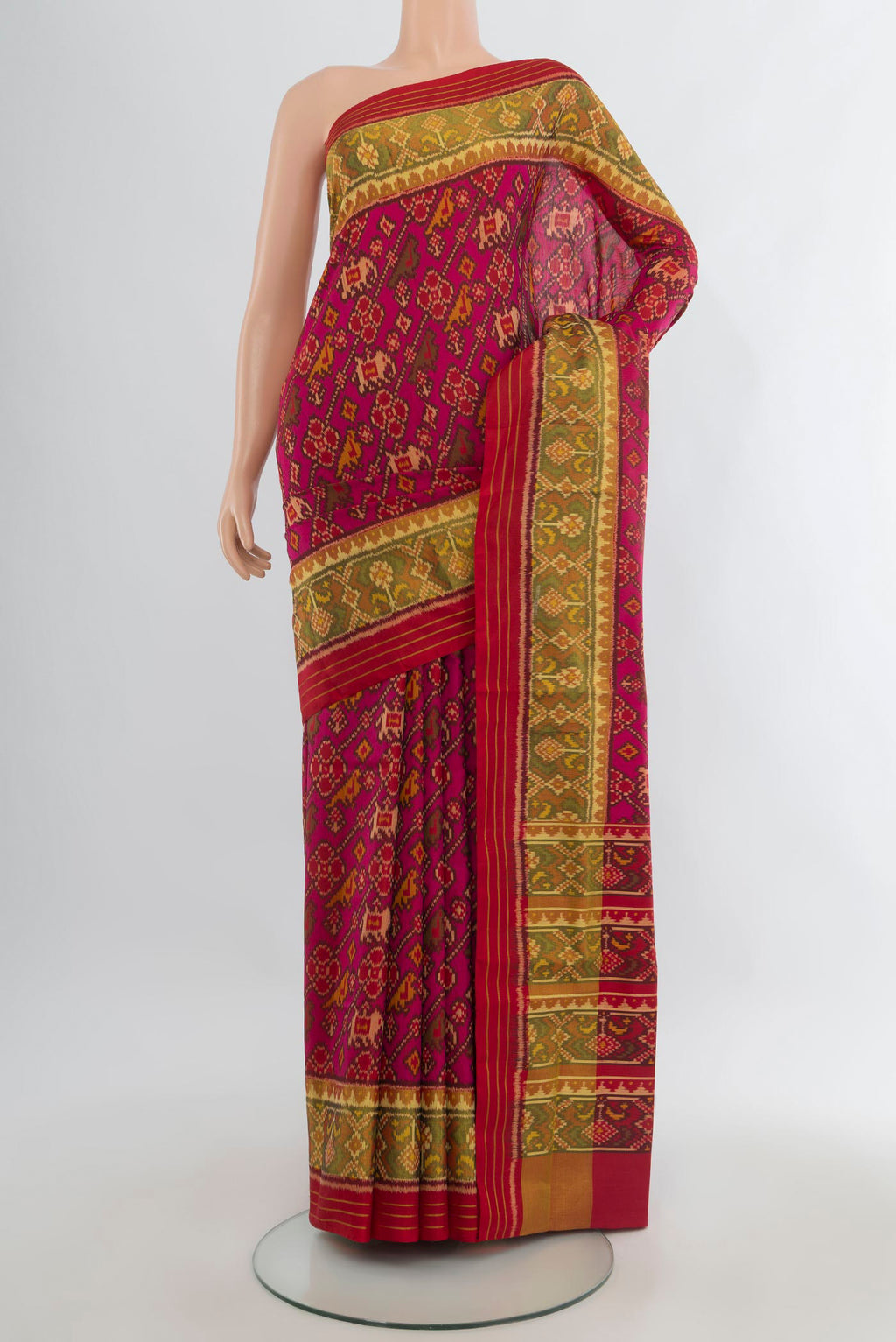 Pure Silk Dark Pink Rajkot Patola Saree with Pure Ikat on the body and Ikat Border.  displayed on a mannequin