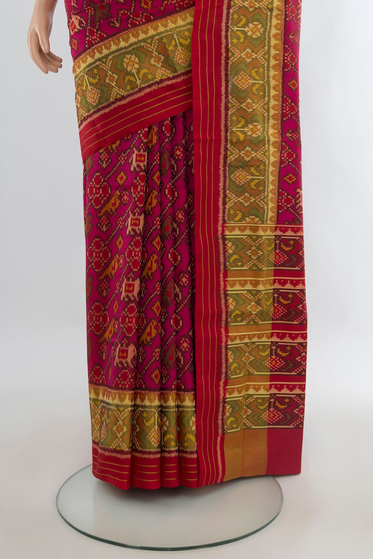 Pleats and pallu of Pure Silk Dark Pink Rajkot Patola Saree with Pure Ikat on the body and Ikat Border. 