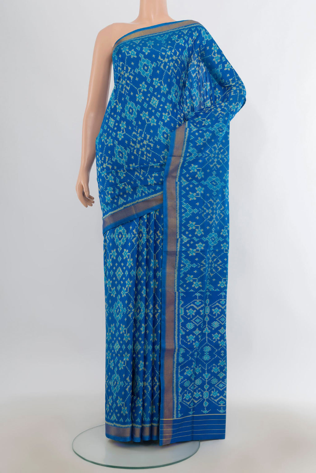 Pure Silk Blue Rajkot Patola Saree with Pure Ikat on the body and Zari Border.  displayed on a mannequin