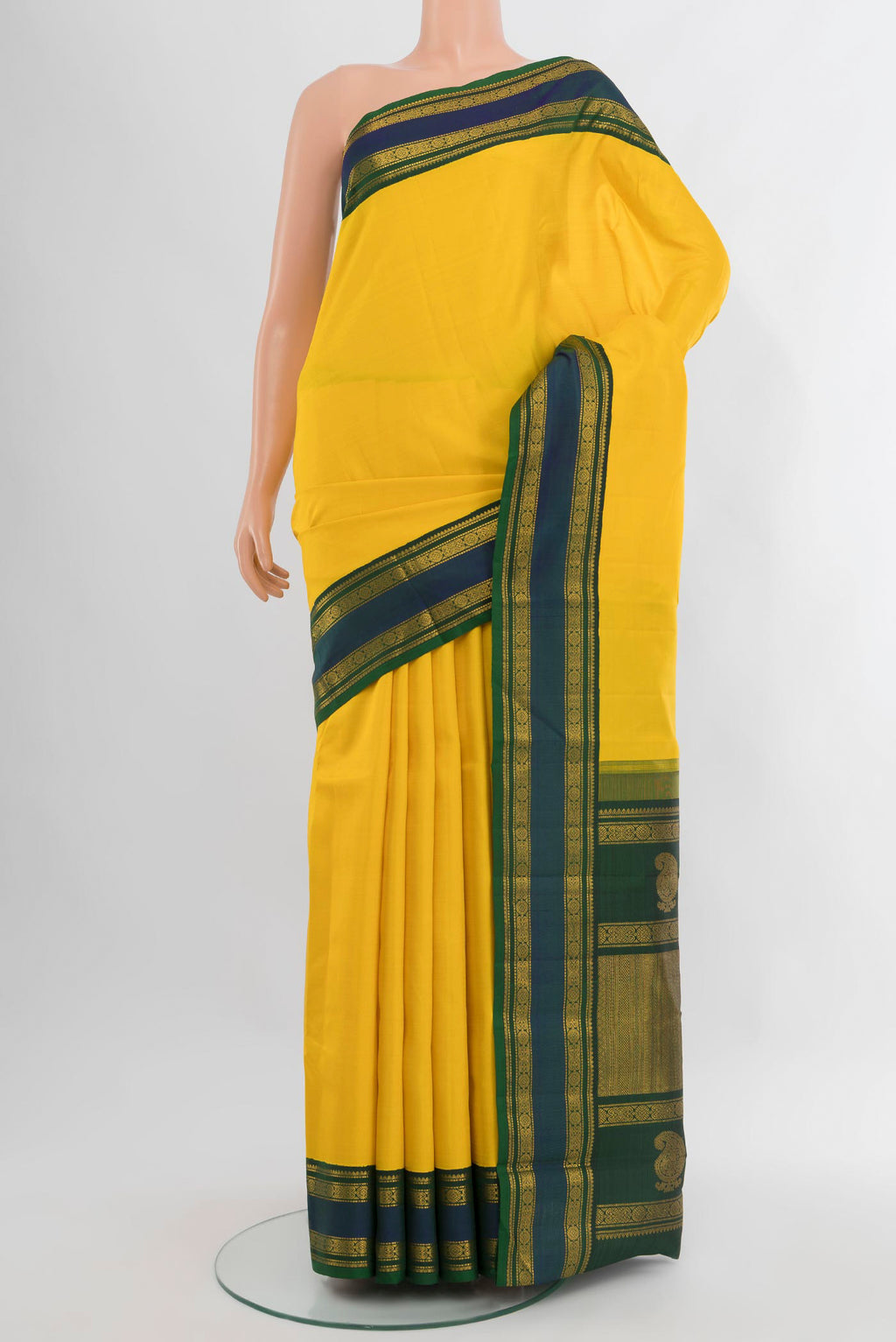 Yellow Kanjivaram Silk Saree with Plain Body and Zari Border.  displayed on a mannequin