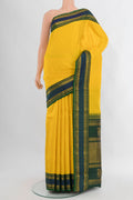 Yellow Kanjivaram Silk Saree with Plain Body and Zari Border.  displayed on a mannequin