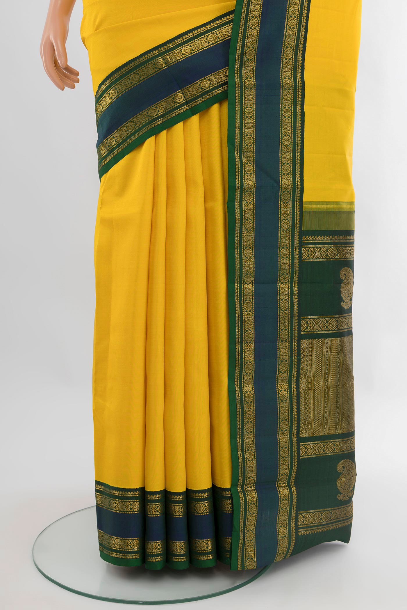 Pleats and pallu of Yellow Kanjivaram Silk Saree with Plain Body and Zari Border. 