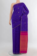 Pure Silk Royal Blue Kanchipuram Saree with Zari Butta on the body and Thin Zari Line.  displayed on a mannequin