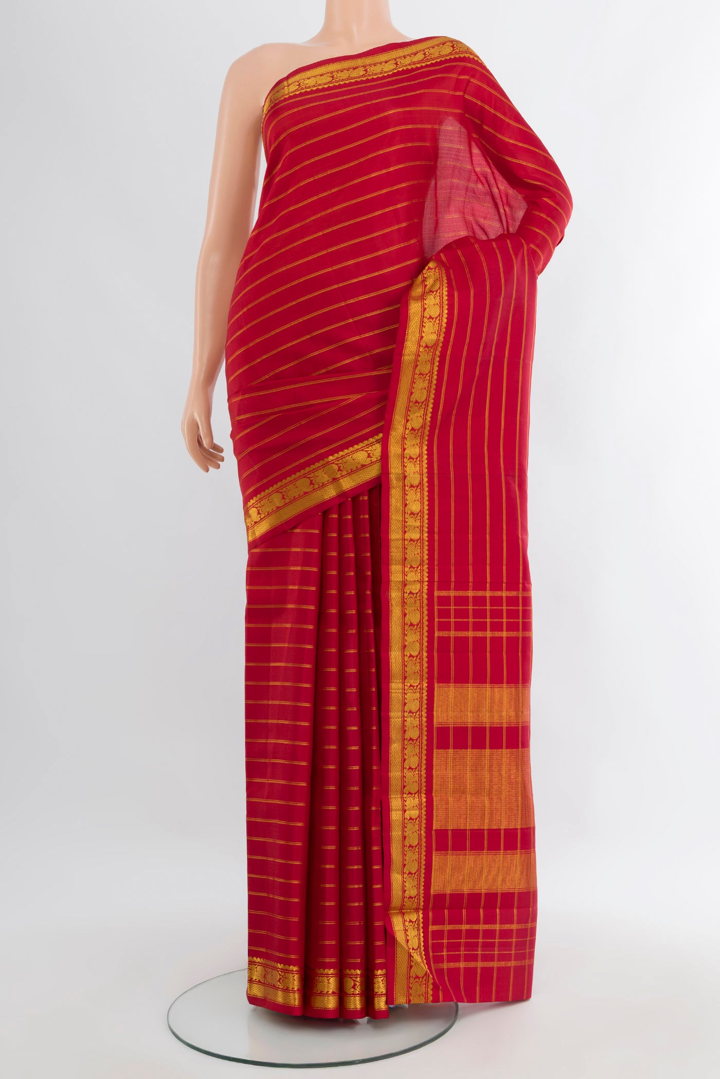 Maroon Kanchipuram Silk Saree with Stripes on the body and Zari Border.  displayed on a mannequin