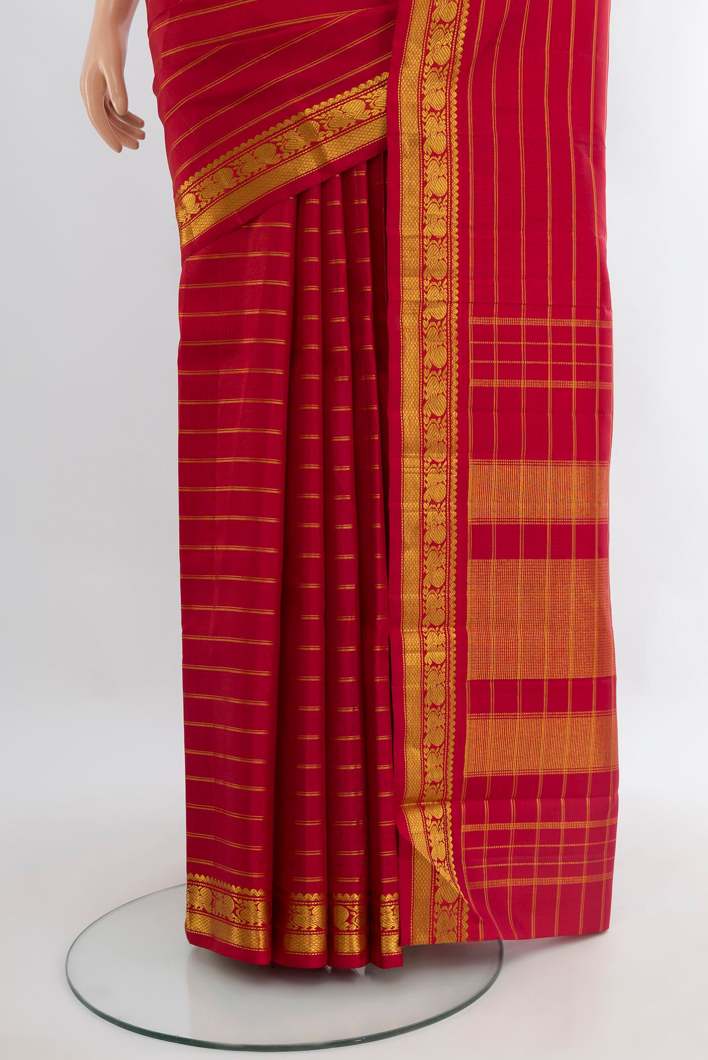 Pleats and pallu of Maroon Kanchipuram Silk Saree with Stripes on the body and Zari Border. 