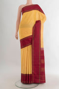 Pure Silk Yellow Kanjivaram Saree with Plain Body and Plain Border.  displayed on a mannequin