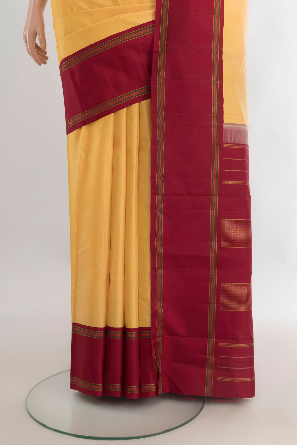 Pleats and pallu of Pure Silk Yellow Kanjivaram Saree with Plain Body and Plain Border. 