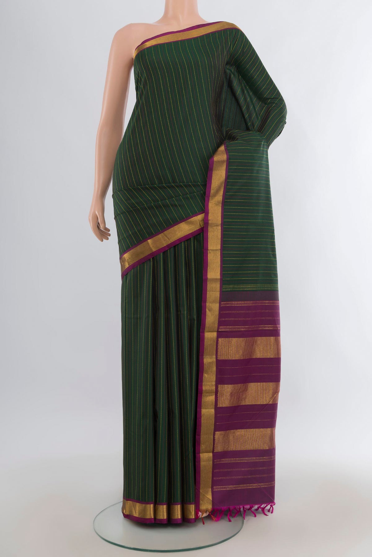Pure Silk Bottle Green Kanchipuram Saree with Stripes on the body and Zari Border.  displayed on a mannequin