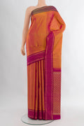 Mustard Kanjivaram Silk Saree with Zari Butta on the body and Plain Border.  displayed on a mannequin