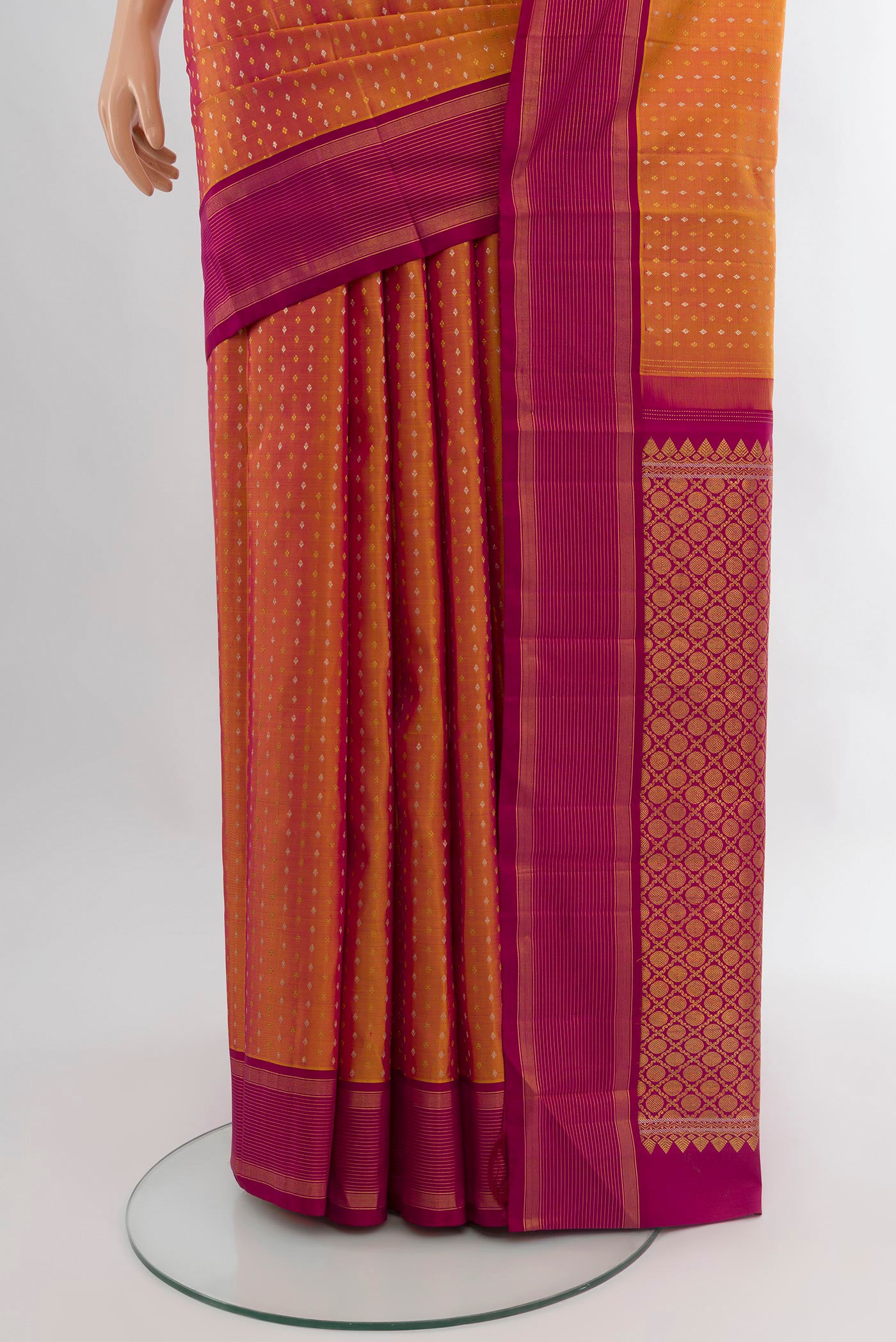 Pleats and pallu of Mustard Kanjivaram Silk Saree with Zari Butta on the body and Plain Border. 