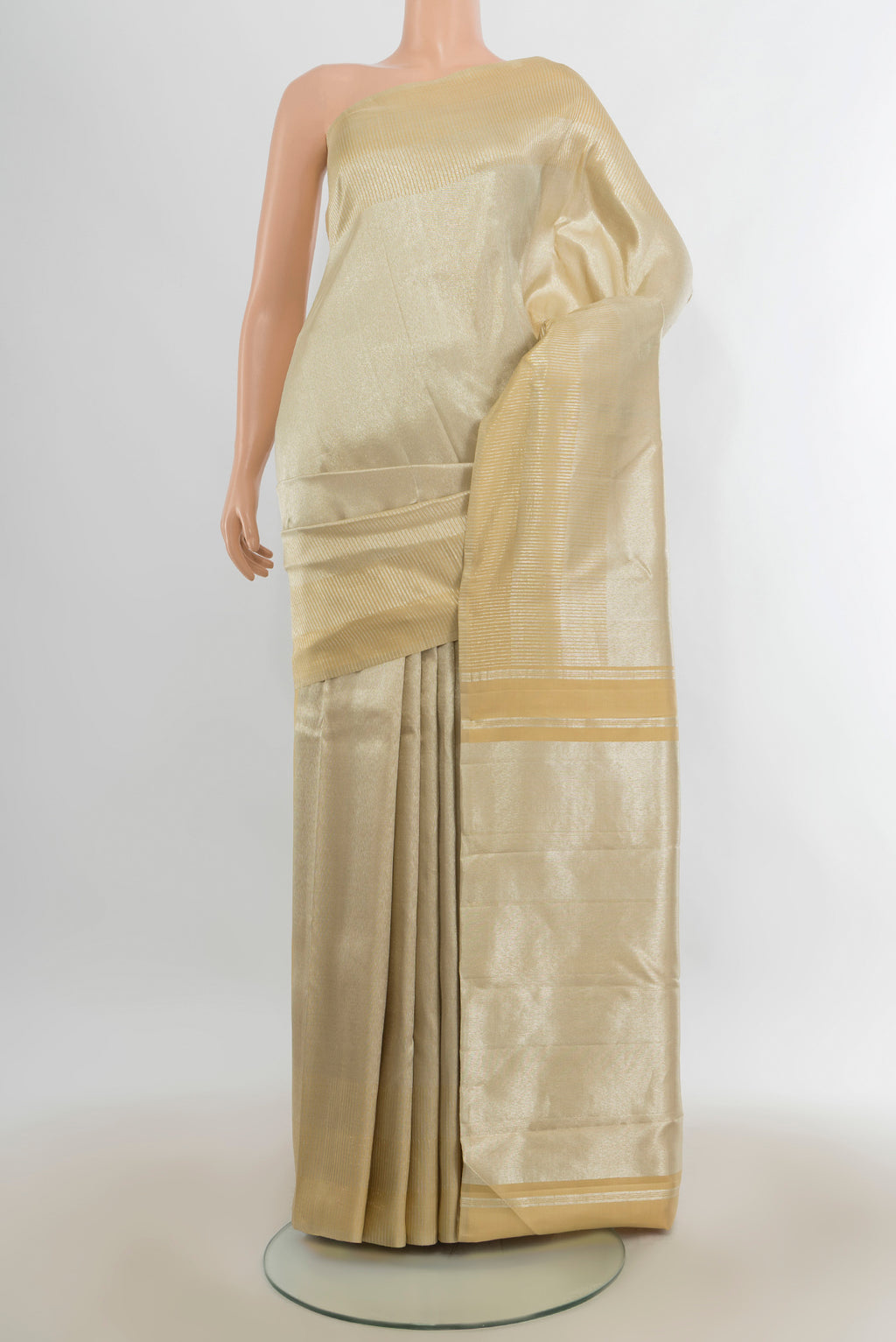 Gold Kanchipuram Tissue Saree with Zari Brocade on the body and Zari Border.  displayed on a mannequin