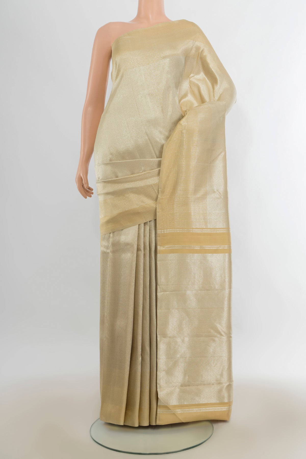 Gold Kanchipuram Tissue Saree with Zari Brocade on the body and Zari Border.  displayed on a mannequin
