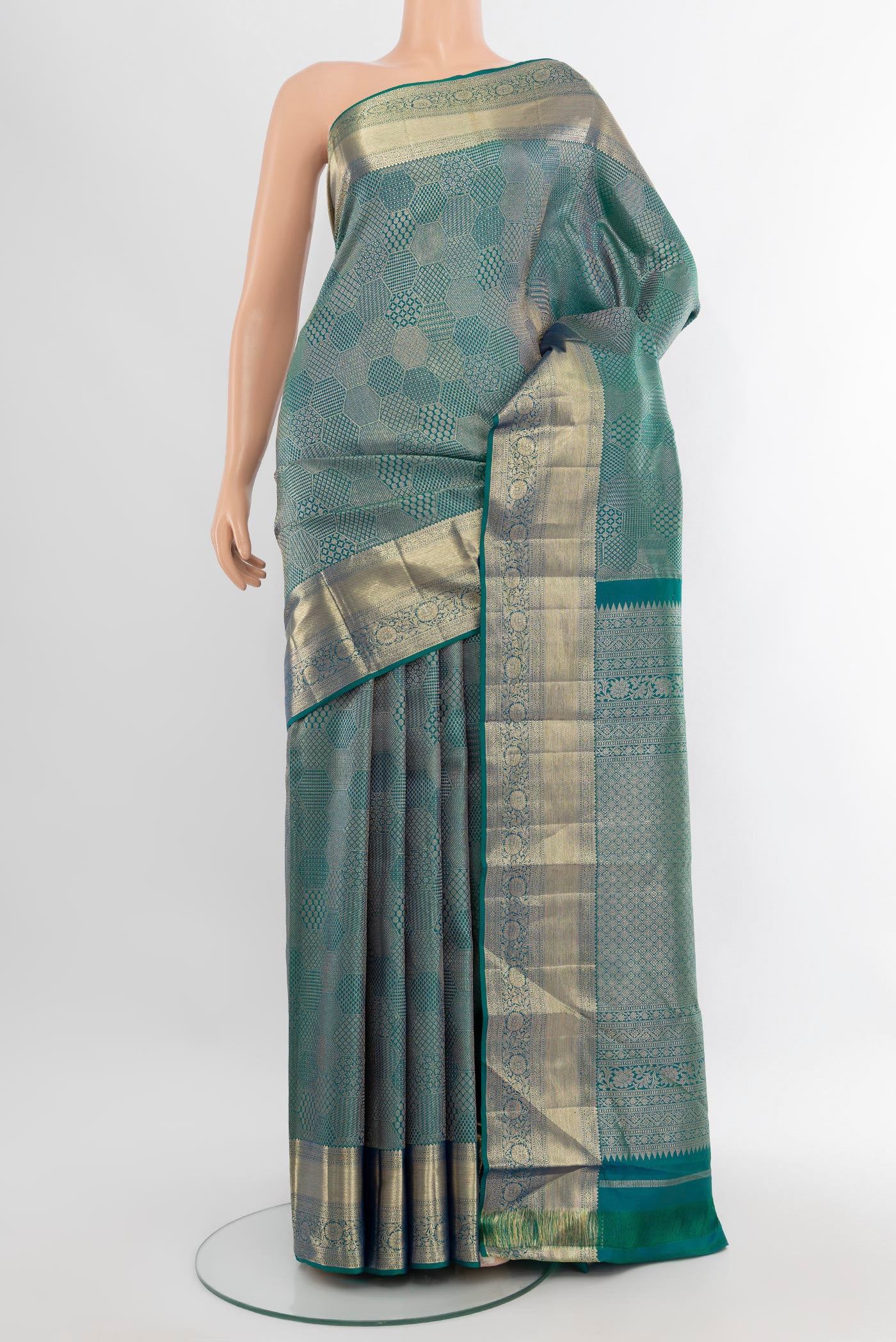 Peacock Blue Kanjivaram Silk Saree with Zari Brocade on the body and Zari Border.  displayed on a mannequin
