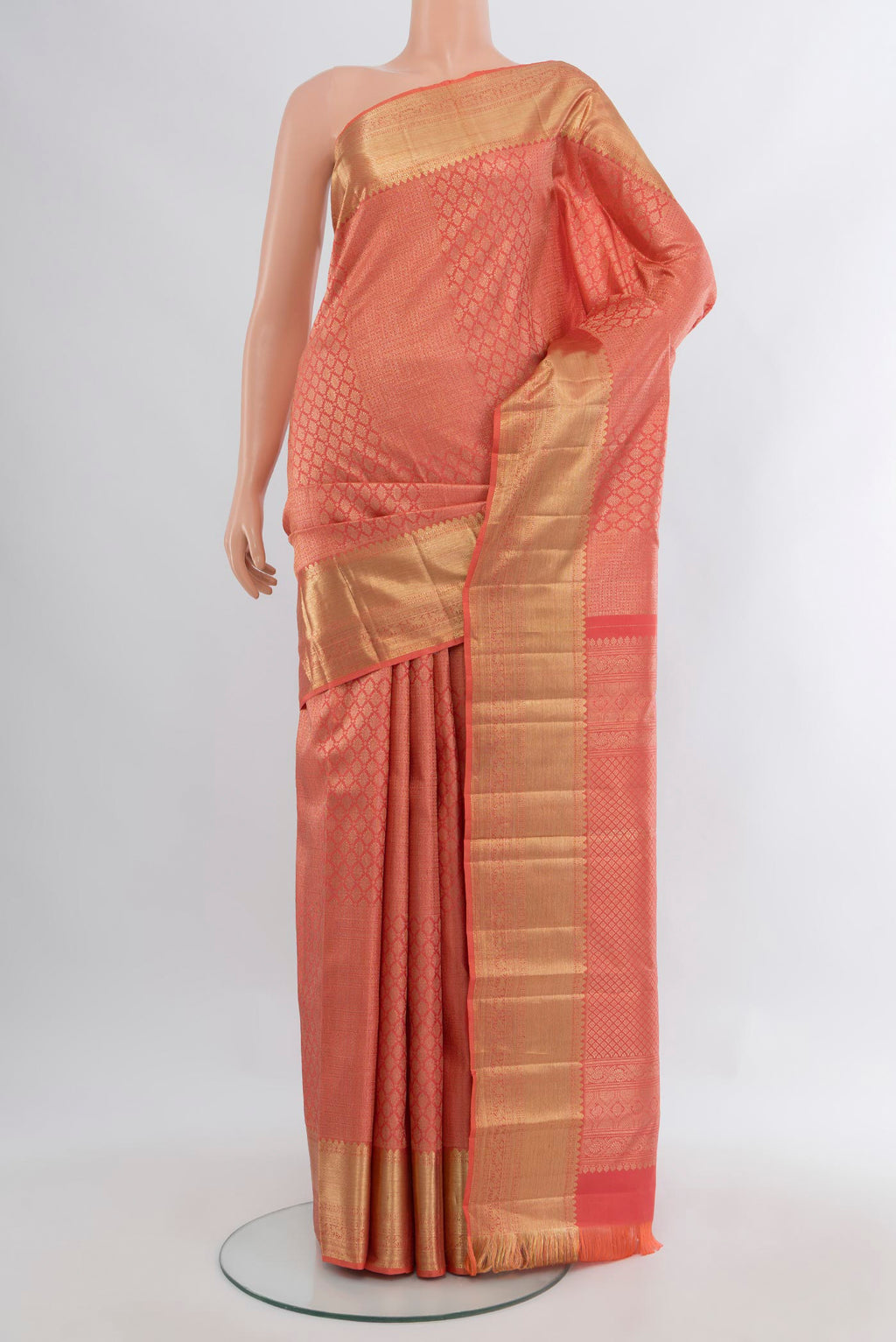 Coral Kanchipuram Silk Saree with Zari Brocade on the body and Zari Border.  displayed on a mannequin