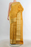 Pure Silk Mustard Kanchipuram Saree with Zari Butta on the body and Silk Border.  displayed on a mannequin