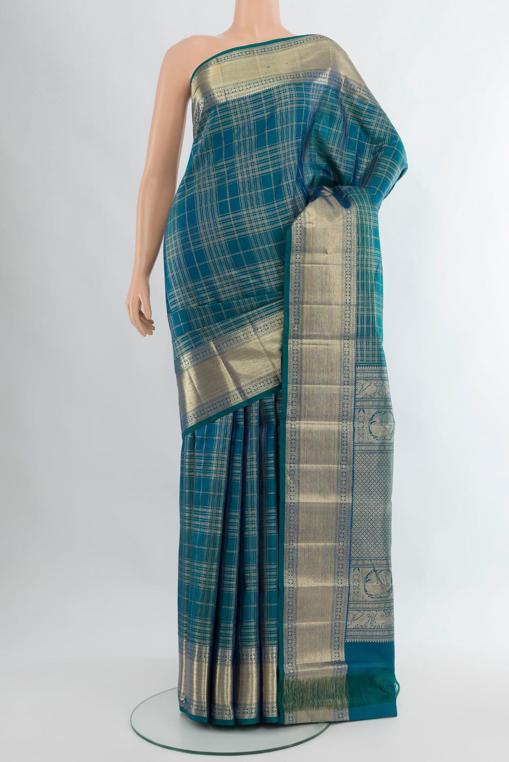 Pure Silk Pure Zari Peacock Blue Kanchipuram Saree with Checked design on the body and Zari Border.  displayed on a mannequin