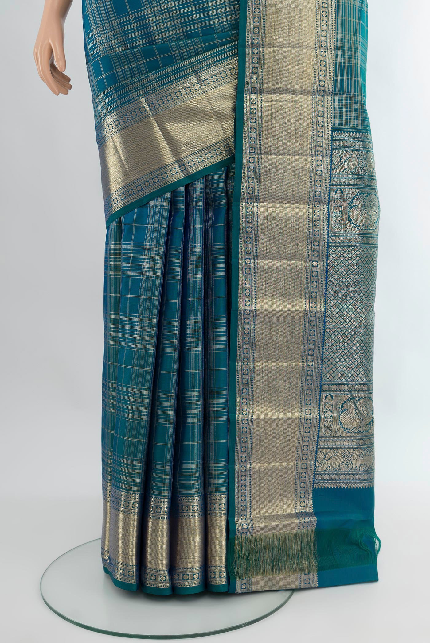 Pleats and pallu of Pure Silk Pure Zari Peacock Blue Kanchipuram Saree with Checked design on the body and Zari Border. 