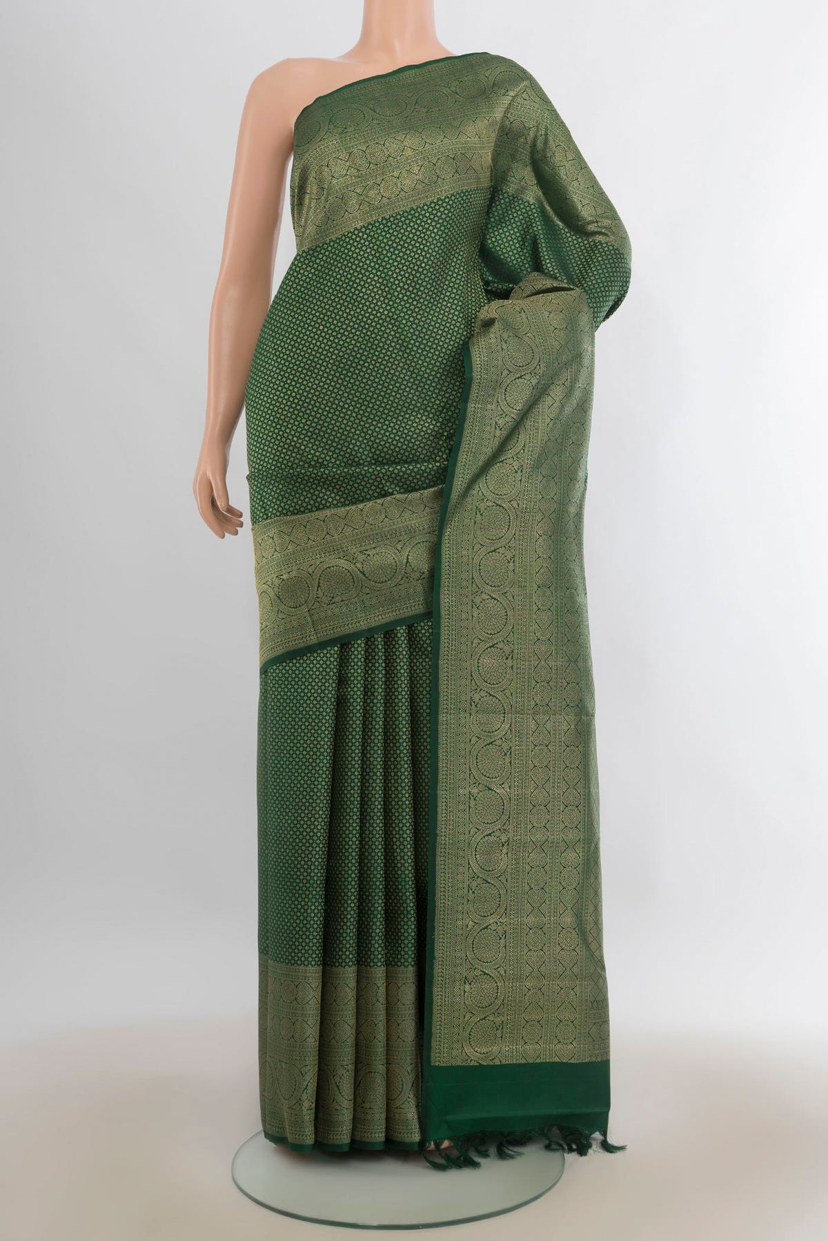 Pure Silk Bottle Green Kanchipuram Saree with Zari Brocade on the body and Zari Border.  displayed on a mannequin