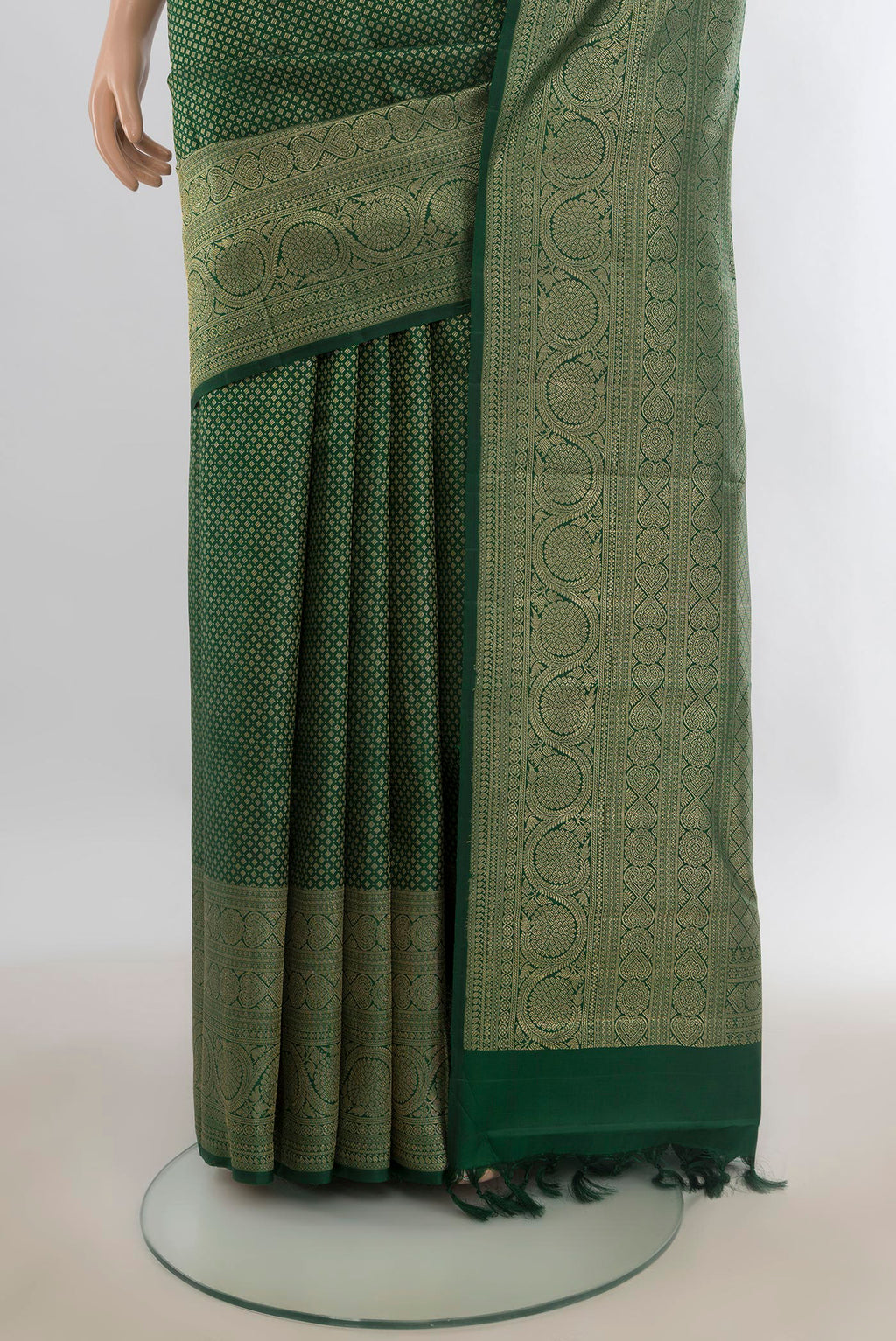 Pleats and pallu of Pure Silk Bottle Green Kanchipuram Saree with Zari Brocade on the body and Zari Border. 