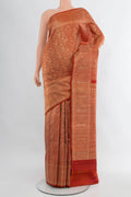 Rust Kanchipuram Silk Saree with Zari Brocade on the body and Zari Border.  displayed on a mannequin